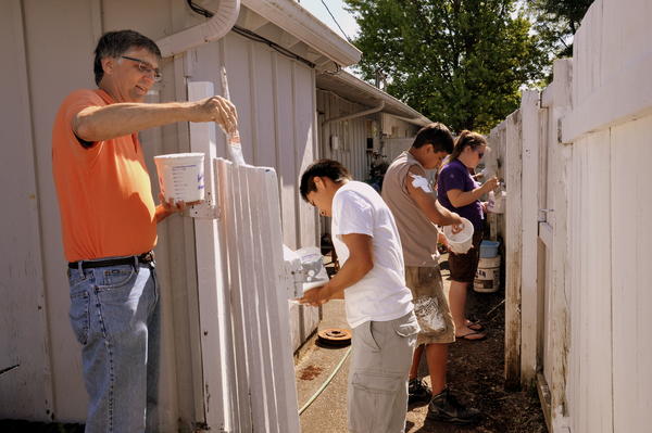 Church Serving Painting Fence in Community